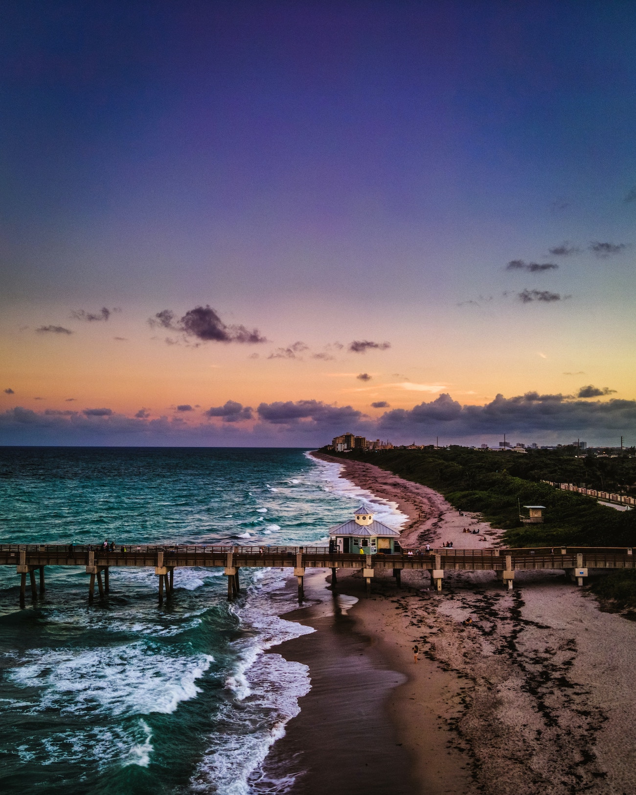 picture of water and pier on beach in juniper florida at dusk